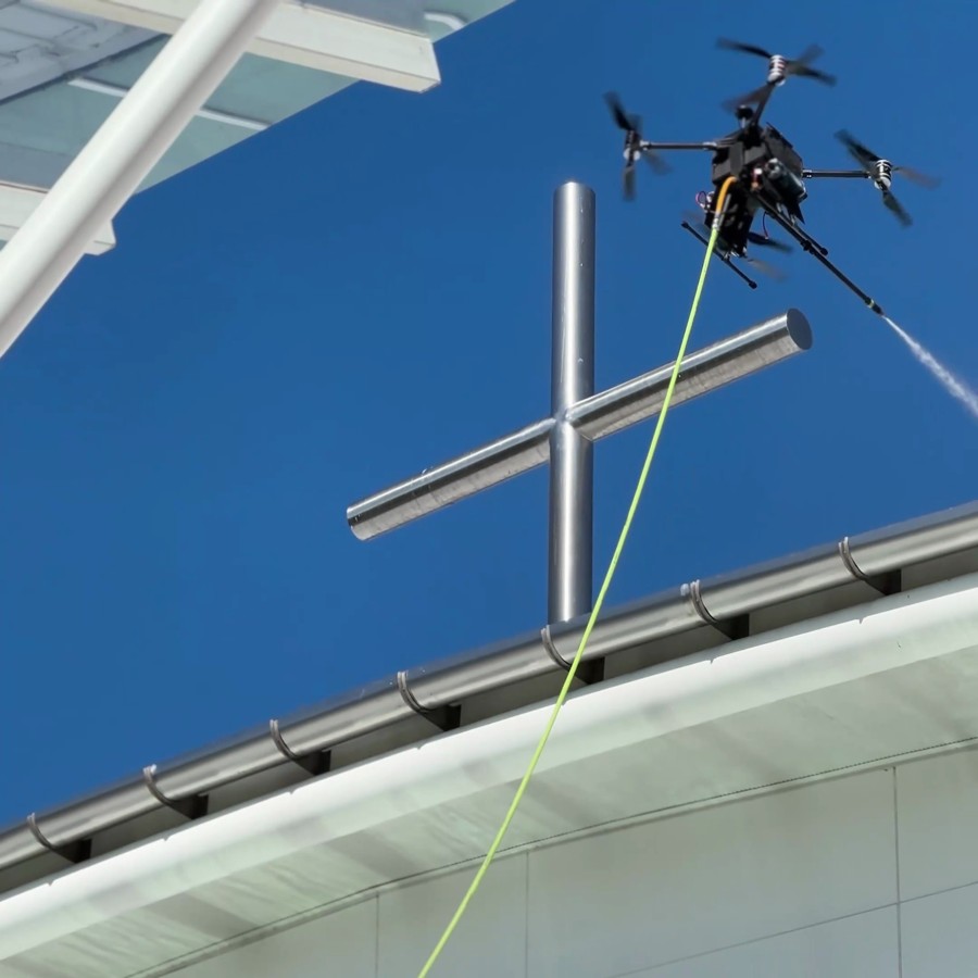 AeroClean drone cleaning a roof line